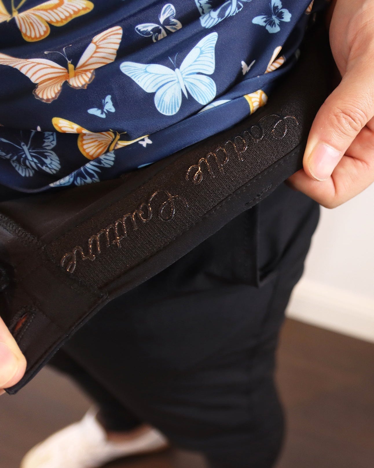 close up of caddie couture detailing in golf joggers 