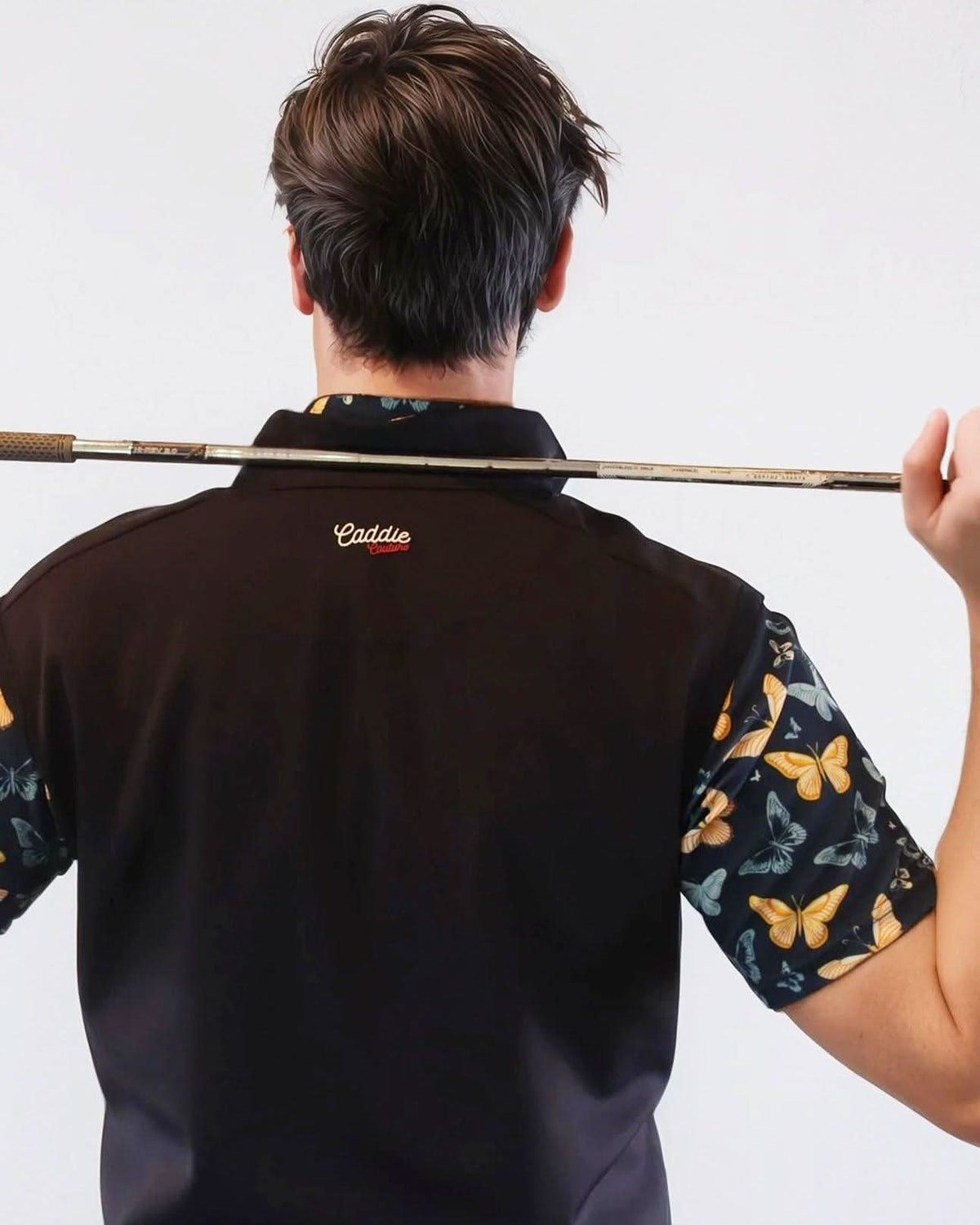 Person wearing a Navy Golf Vest with a visible brand logo on a white background
