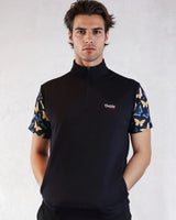 Man wearing a black quarter-zip shirt with butterfly pattern sleeves on a white background