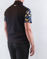 Person wearing a Navy Golf Vest with butterfly pattern sleeves on a white background