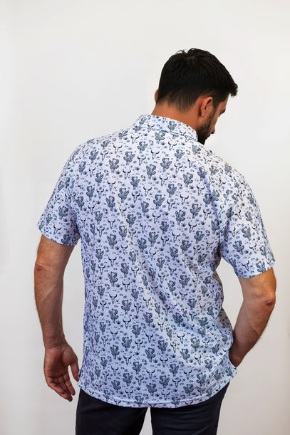 man wearing desert golf polo with back to camera