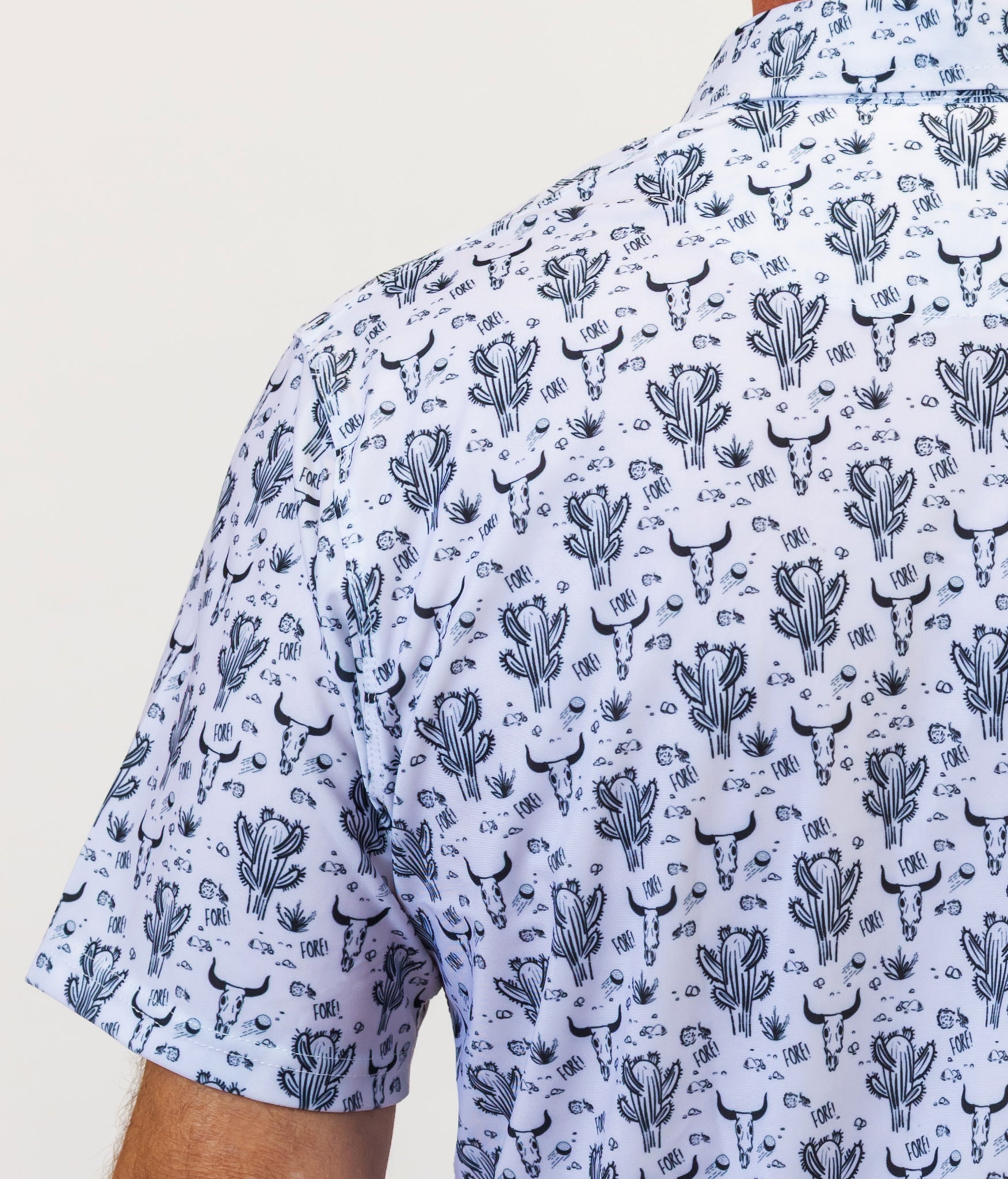 Short-sleeve golf shirt with cactus pattern on a plain background