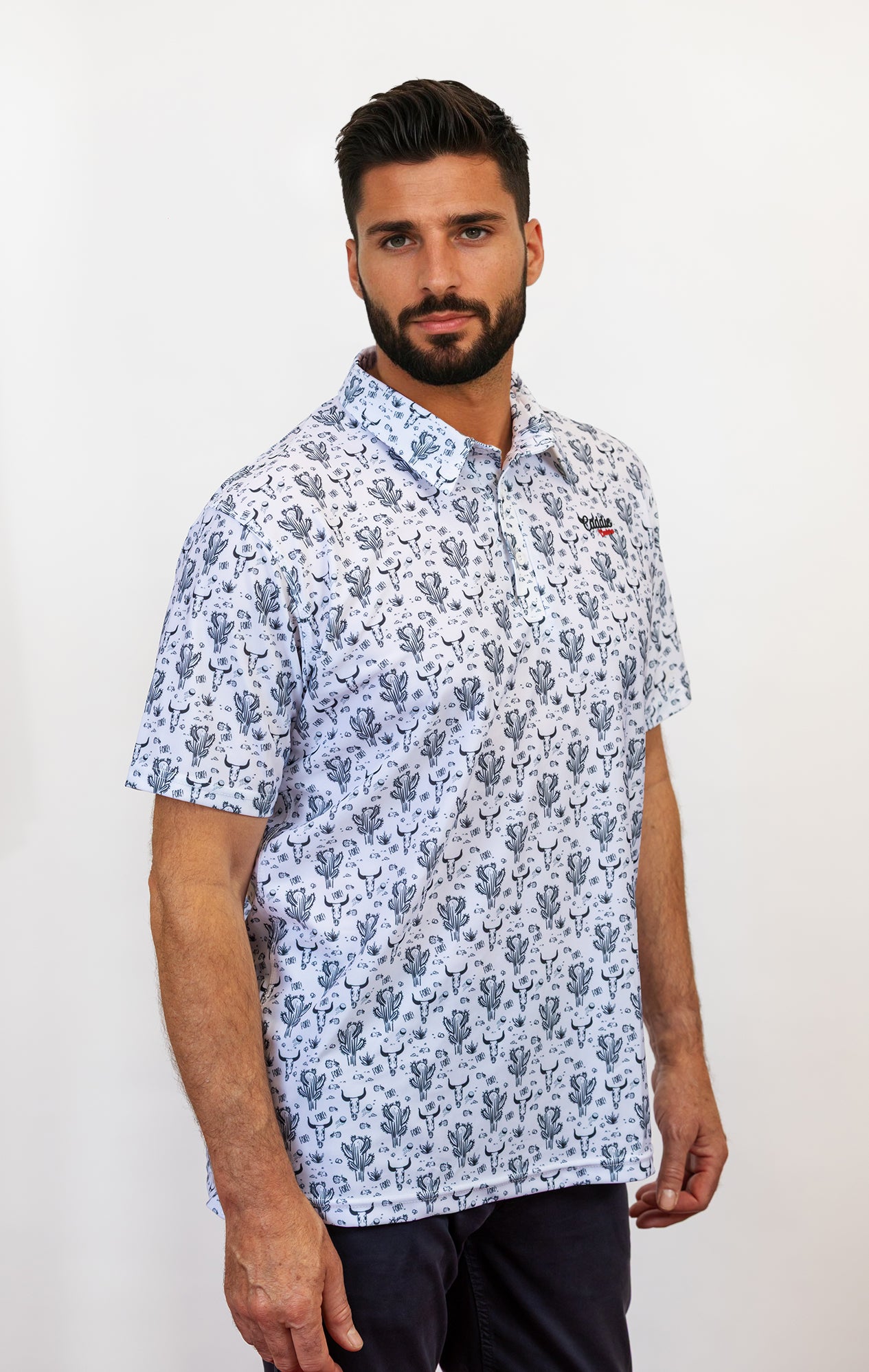 Man wearing a cactus and bull golf polo side facing