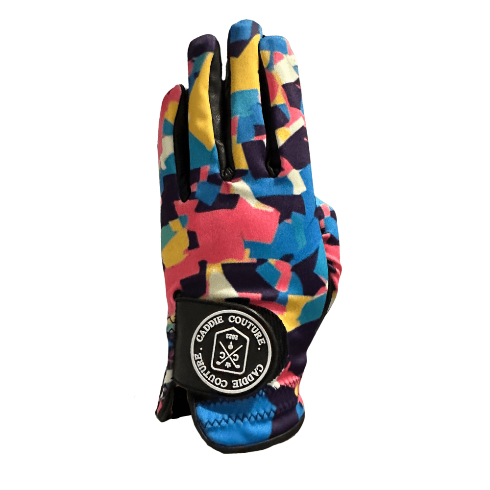 A multicolored patterned golf glove with the brand logo visible on the wrist area.