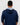 Person wearing a navy blue golf hoodie with a pattern inside on a white background