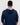 Person wearing a navy blue golf hoodie with a pattern inside on a white background