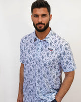 Man wearing a cactus golf shirt with hand in pocket