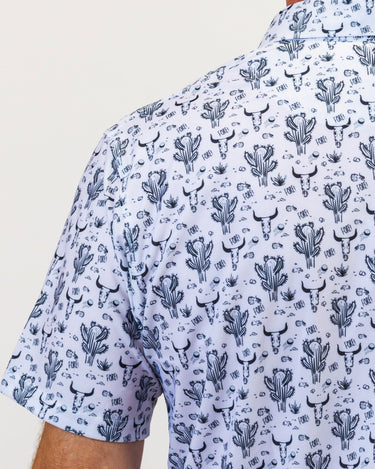 Short-sleeve golf shirt with cactus pattern on a plain background