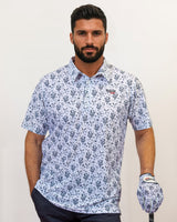Man wearing a cactus and Bull head pattern golf shirt, holding a golf club.