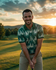 Man on a golf course with a sunset in the background