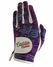 Golf glove with colorful design and 'Caddie Couture' branding on a white background