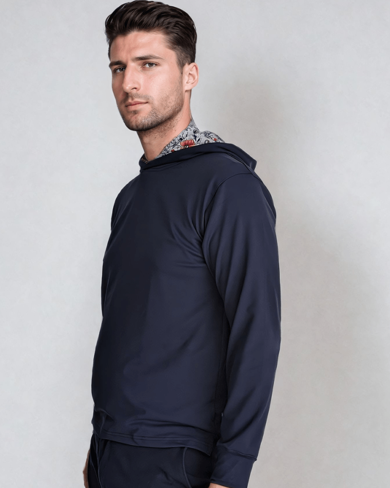 A male model wearing a Floral Performance Golf Hoodie