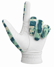 A white leather golf glove with a green and beige camouflage pattern on the back of the hand and along the sides of the fingers, shown against a plain white background.