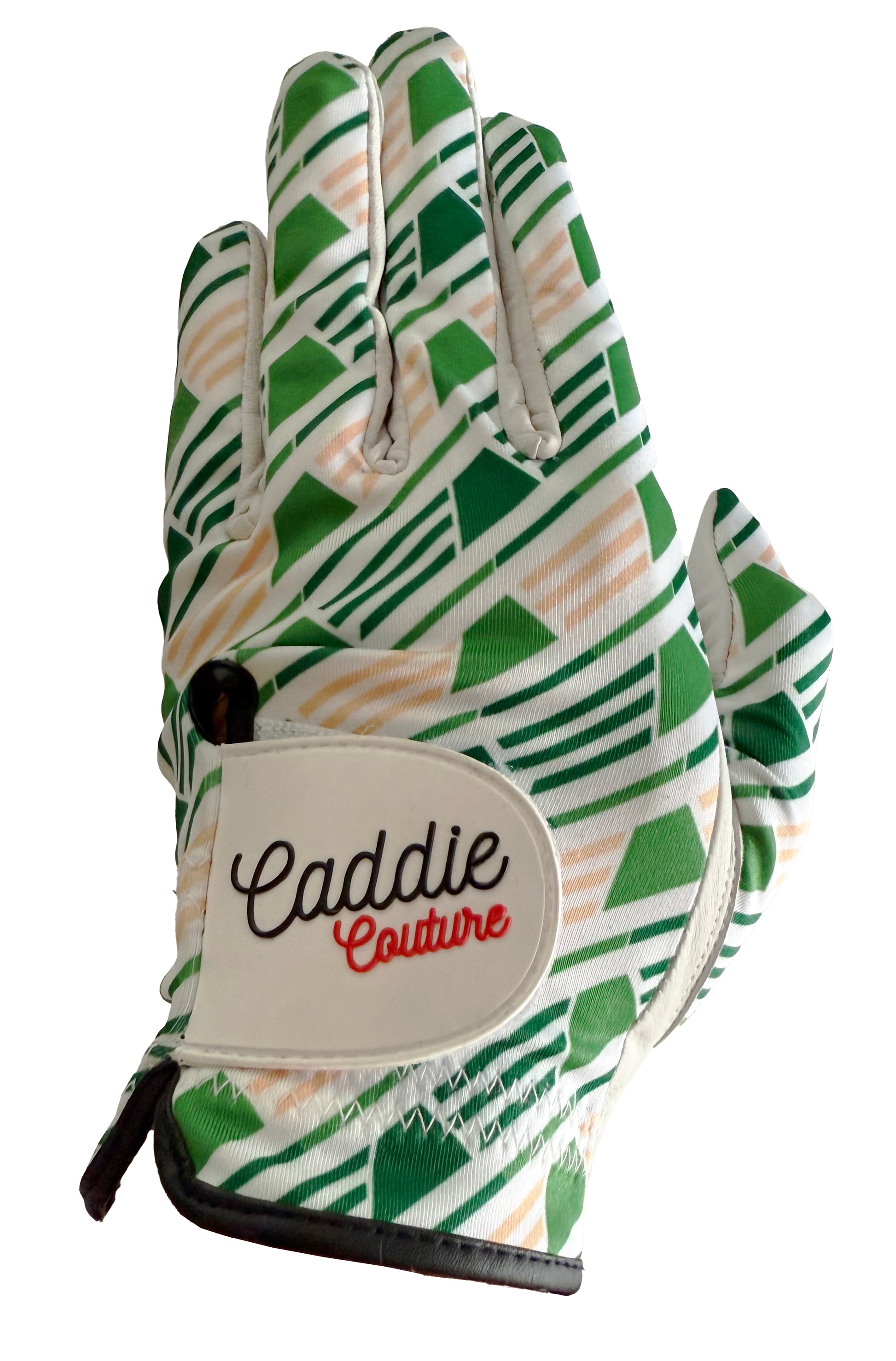 Golf glove with green and beige pattern and 'Caddie Couture' branding on a white background