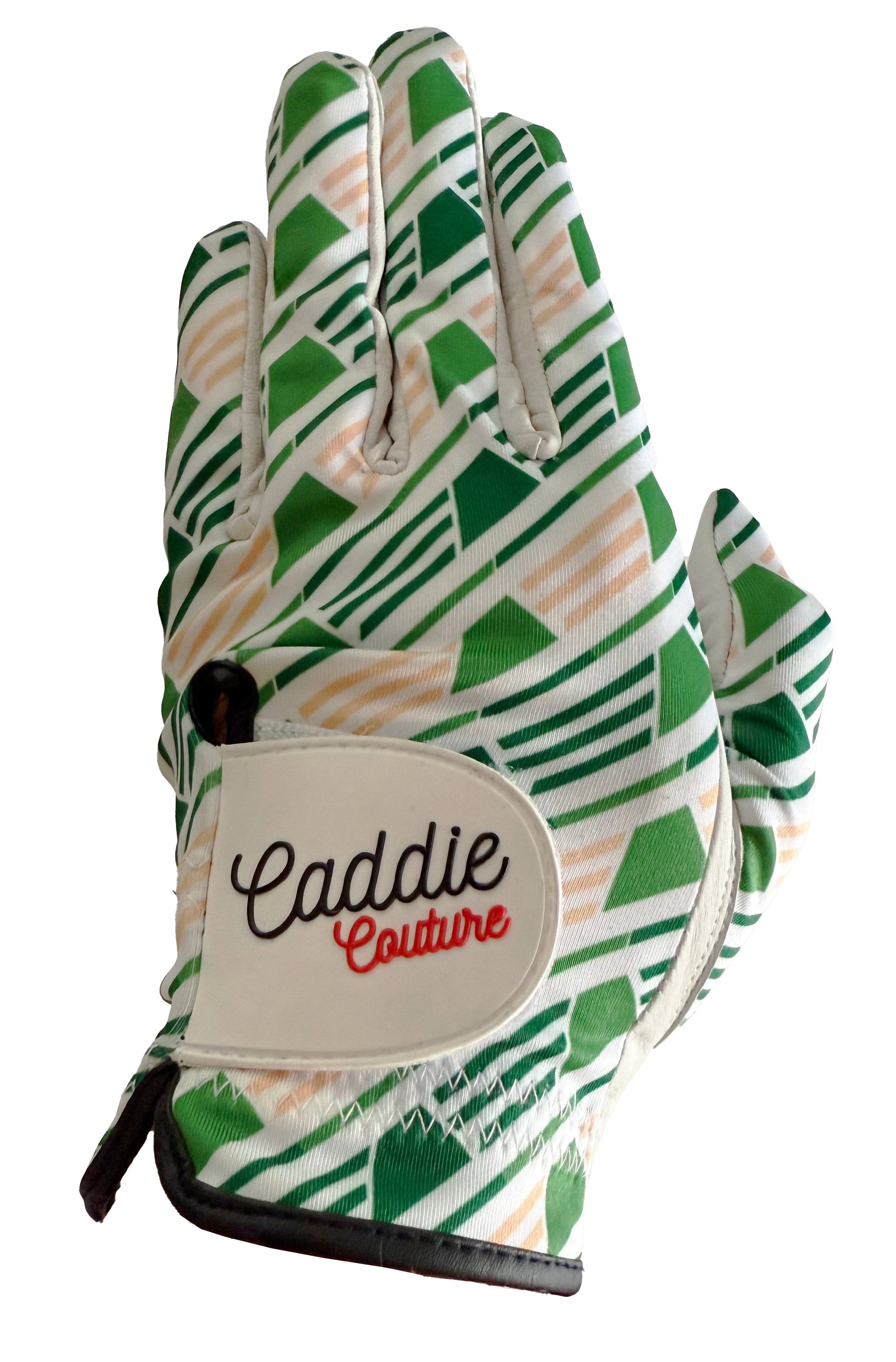 Golf glove with green and beige pattern and 'Caddie Couture' branding on a white background