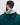 Person wearing a green golf hoodie with a patterned hood against a white background