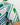 Close-up of a green and white geometric patterned golf shirt with a blurred background