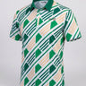 Green and white patterned polo shirt on a light gray background