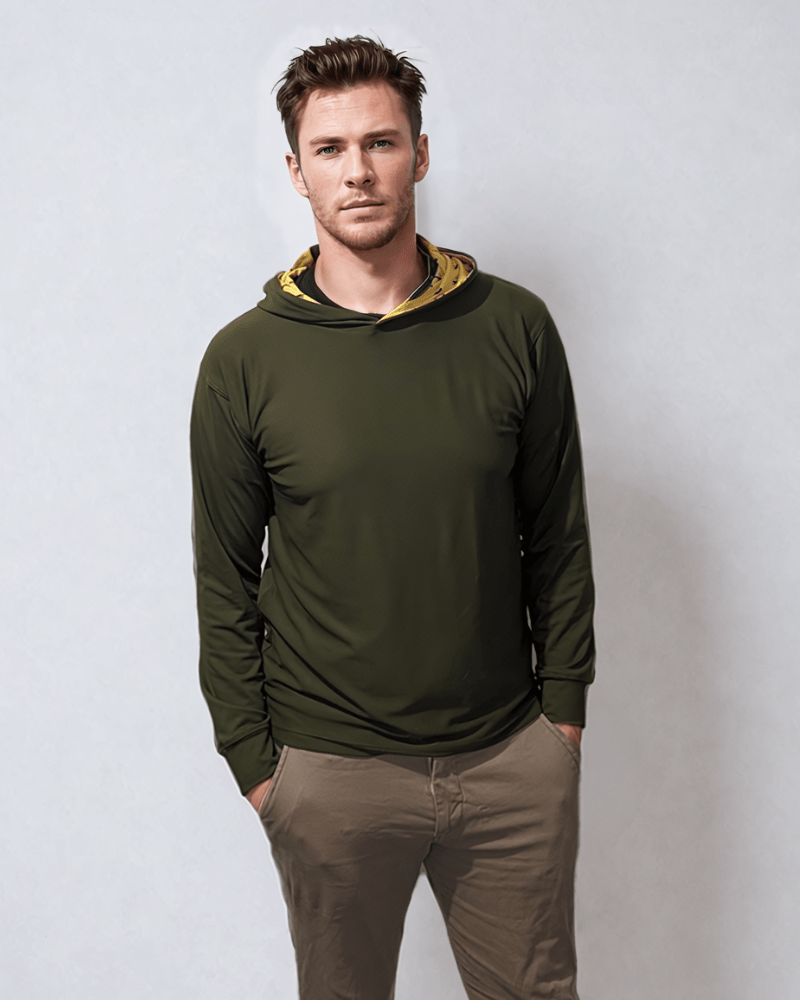 male model wearing green link golf hoodie with hands in pockets