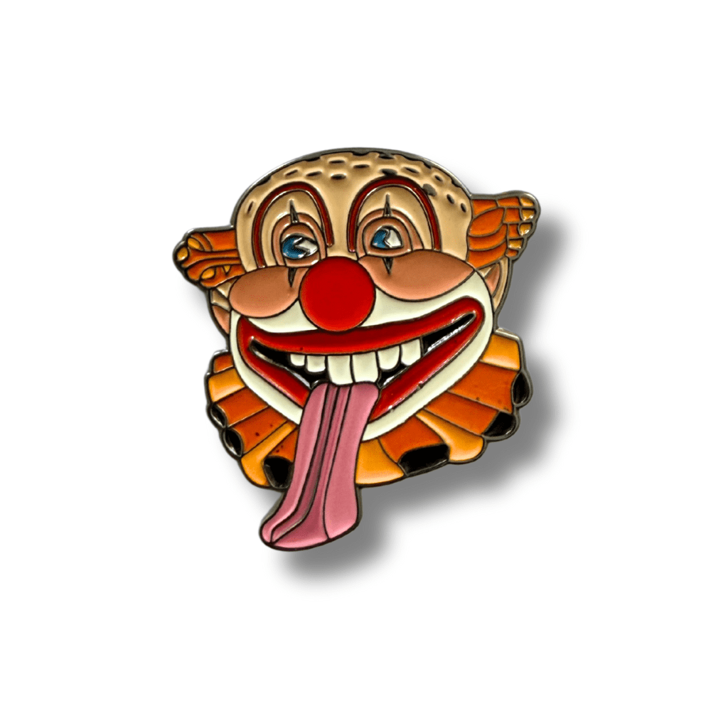 Clown face golf ball marker on a white background