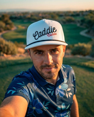 MAN WEARING CADDIE COUTURE CAP ON GOLF COURSE