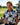 Woman holding a golf club on a golf course with a clubhouse in the background