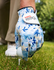 Golf glove with floral pattern on a golf course
