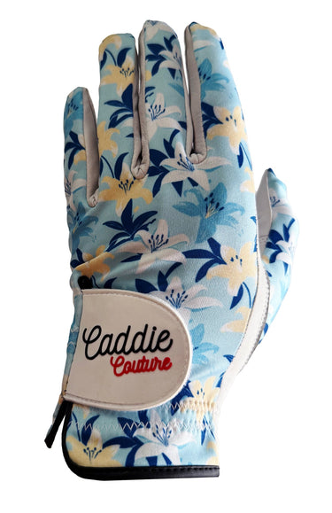 Floral patterned golf glove with 'Caddie Couture' branding on a white background