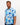 Man wearing a blue floral patterned golf shirt on a plain background