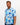 Man wearing a blue floral patterned golf shirt on a plain background