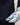 Person wearing a blue floral glove on a neutral background