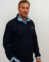 Man wearing golf quarter zip with floral pattern side view