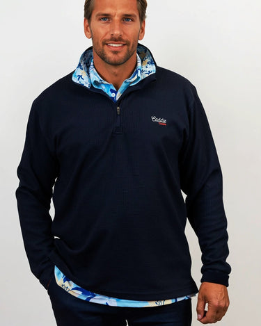 Man wearing golf quarter zip with floral pattern