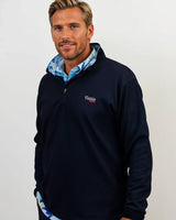 Man wearing golf quarter zip with floral pattern