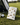 Golf bag with bird-themed pouch on a golf course