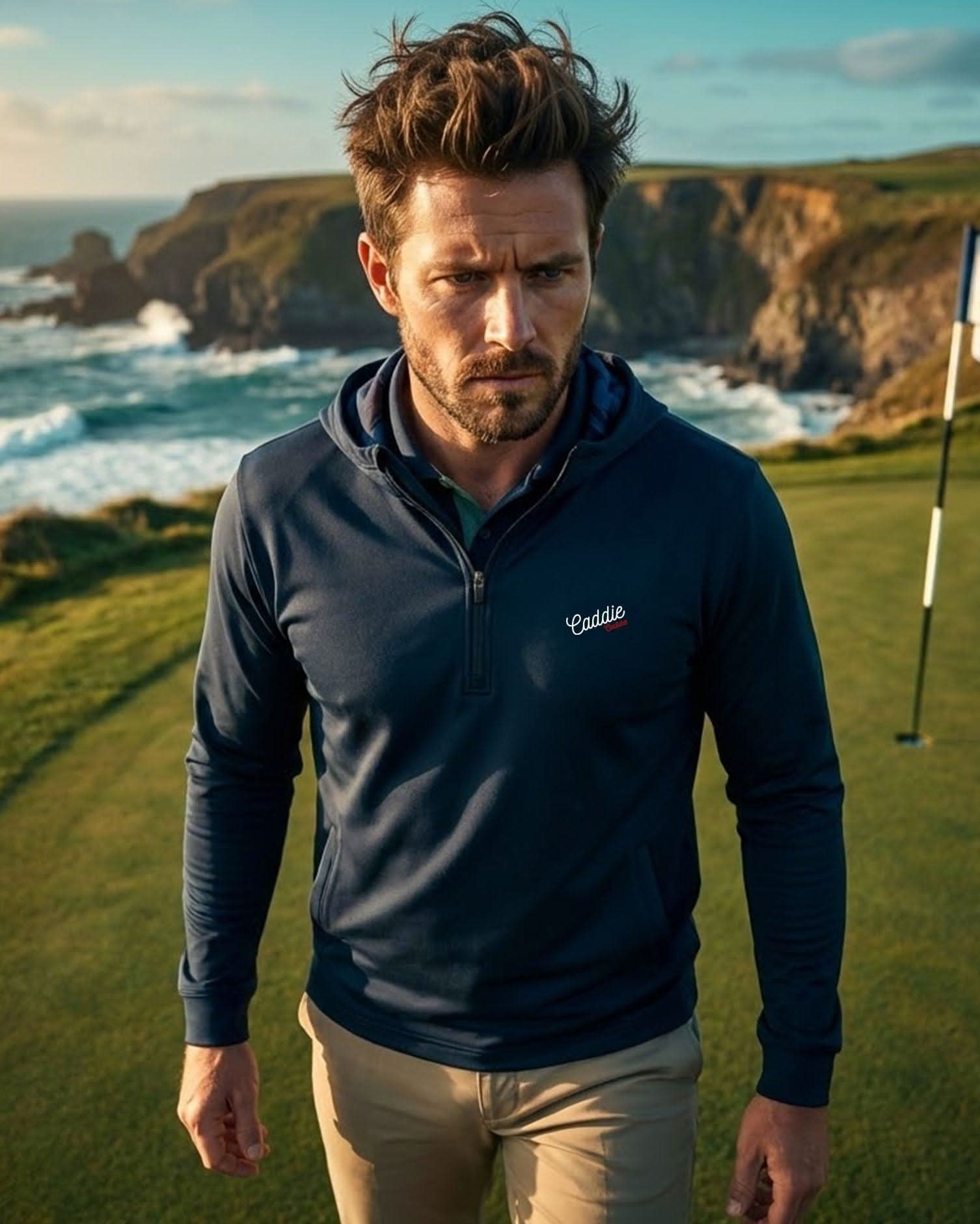 Man standing on a golf course with ocean and cliffs in the background