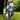 Golf glove and ball on a tee with a blurred green background