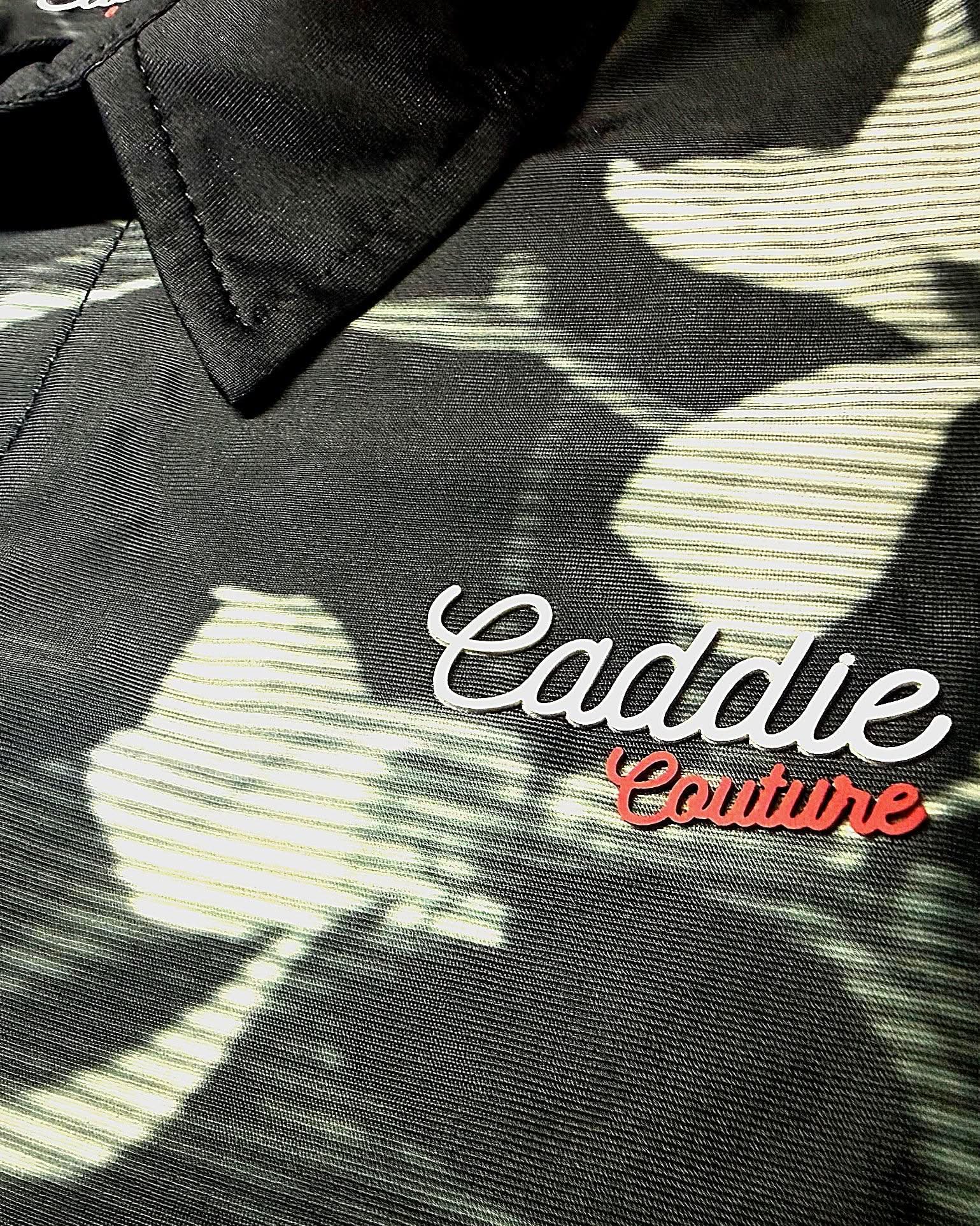 Close-up of Monochrome Edge polo linework, branding and fabric