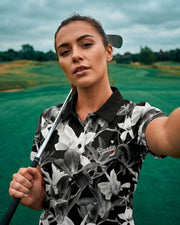 Woman holding a golf club on a golf course