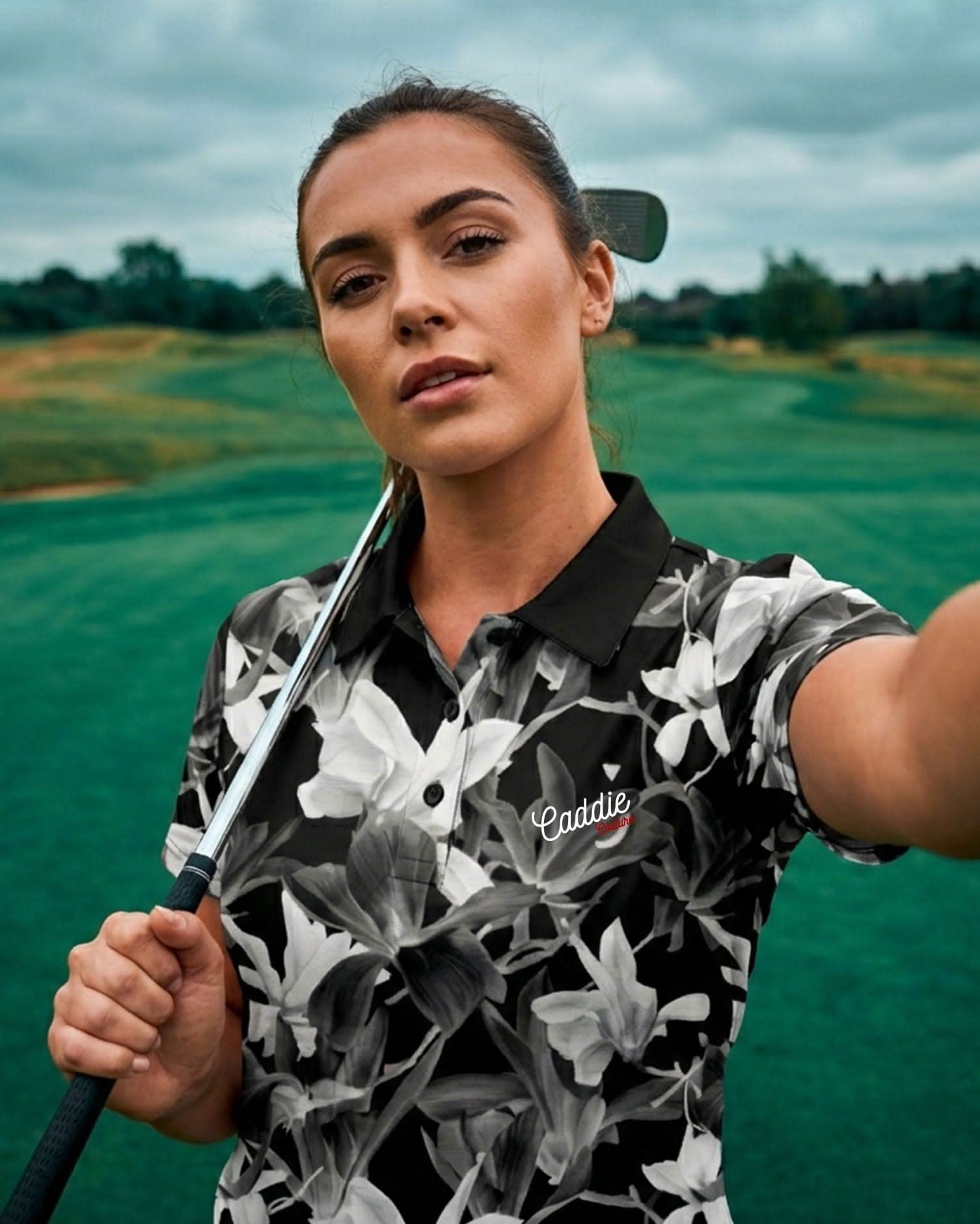 Woman holding a golf club on a golf course