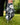 Golf glove and ball on a tee with a blurred green background