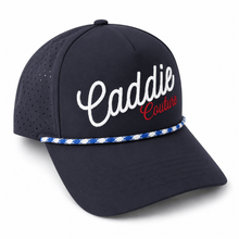 Navy blue cap with 'Caddie Couture' text on a white background