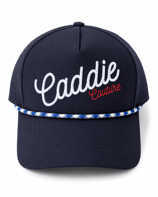 Navy blue cap with 'Caddie Couture' text on a white background