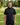 Man wearing a black hoodie with a logo on a golf course