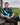 Man sitting on a chair with a golf course in the background