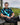 Man sitting on a chair with a golf course in the background