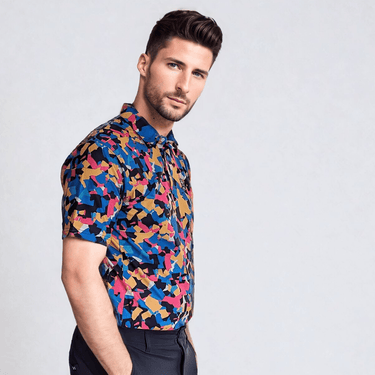 A man wearing a short-sleeved multicolor geometric patterned golf polo shirt. side view