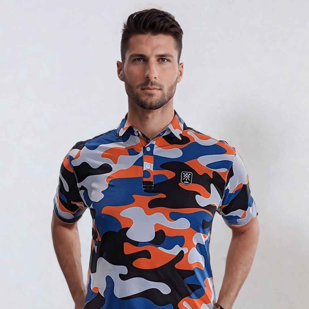 A man wearing a short-sleeved urban camo patterned golf polo shirt in blue, orange, and black colors.