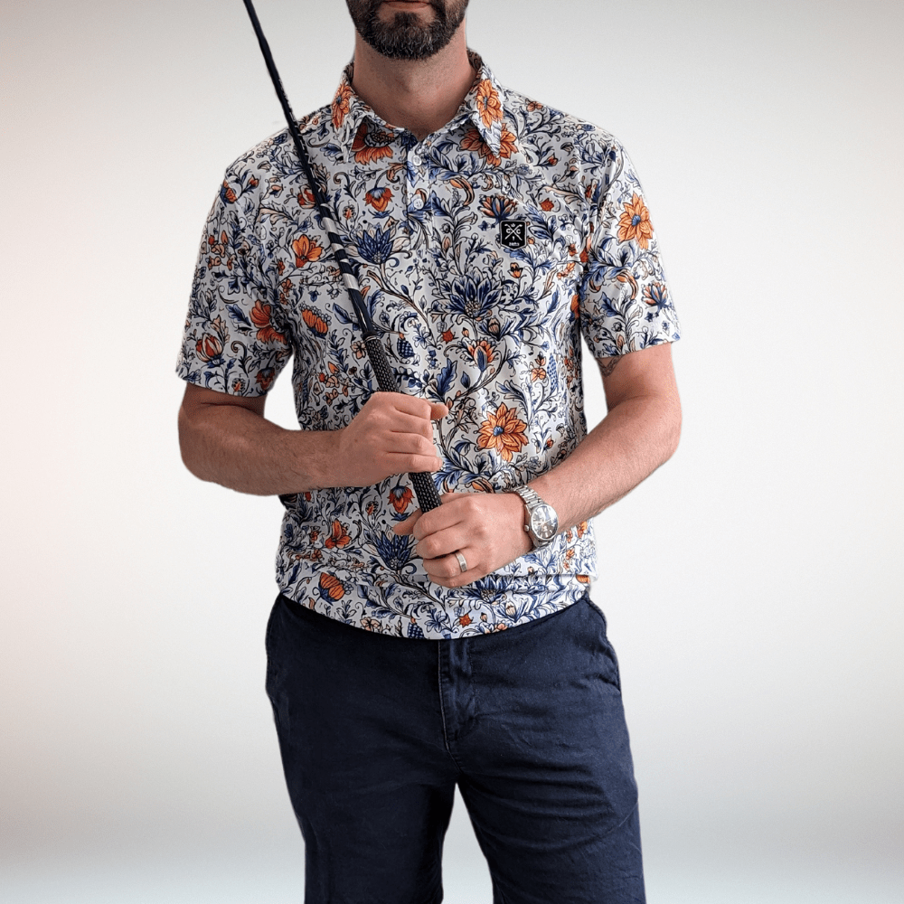 Man holding golf club wearing vintage floral golf polo shirt