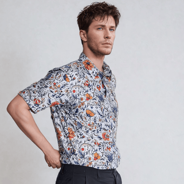 male model side view wearing a vintage floral golf polo shirt